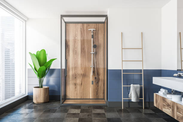 istock Wooden shower in white and blue bathroom 1043825220