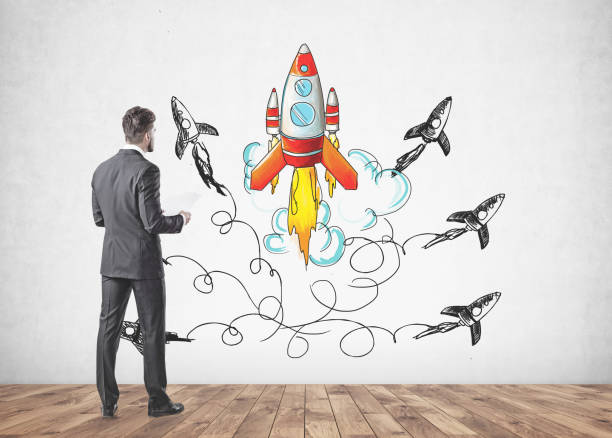 istock Businessman with papers, start up rocket 1043825300