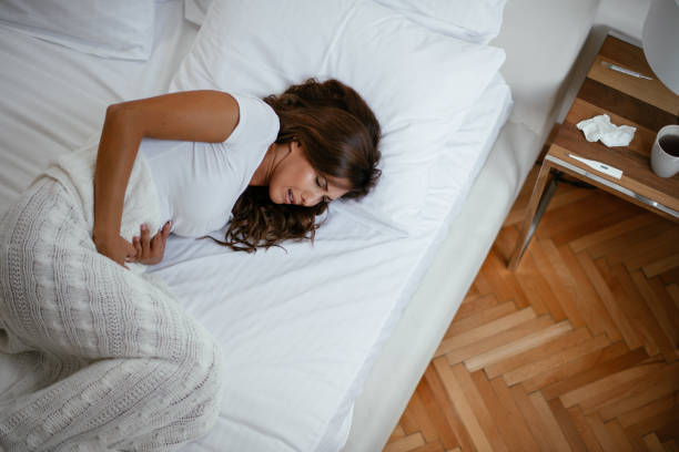 istock Woman with a stomach ache 1043828862