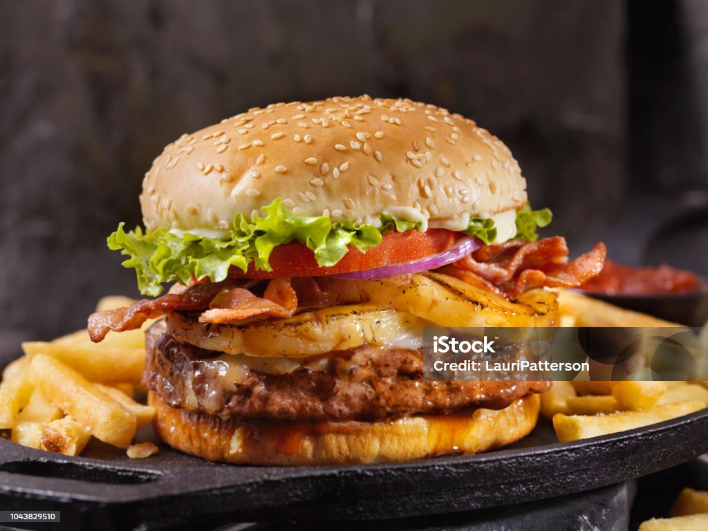 Hawaiian Teriyaki, Pineapple and Bacon Burger with Fries Hamburger Stock Photo