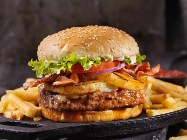 Hawaiian Teriyaki, Pineapple and Bacon Burger with Fries Hawaiian Teriyaki, Pineapple and Bacon Burger with Fries bacon cheeseburger stock pictures, royalty-free photos & images