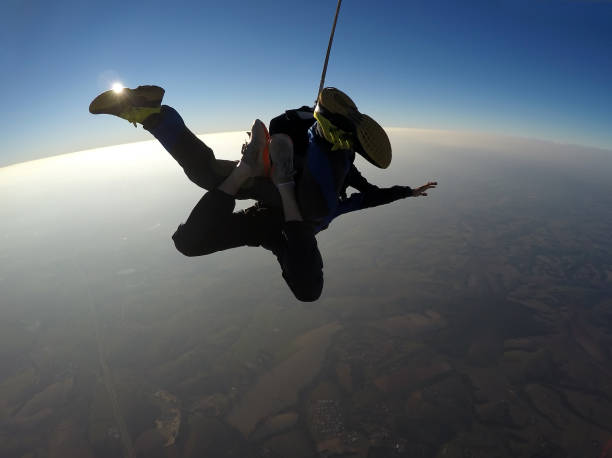 istock Skydive tandem jump at the sunset 1043831888