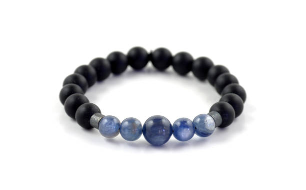 istock Kyanite and black onyx stone beads bracelet on white 1043832298