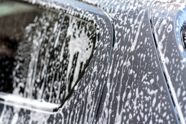 istock washing a car at the car wash 1043833010