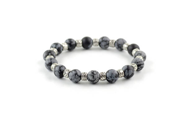 istock Snowflake obsidian beads bracelet isolated on white 1043833692