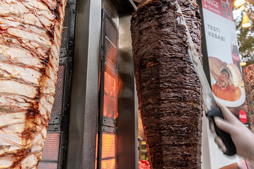 Doner kebab Restaurant in sultanahmet square.\nDonner kebab is a Turkish dish made of lamb meat cooked on a vertical spit and sliced off to order.