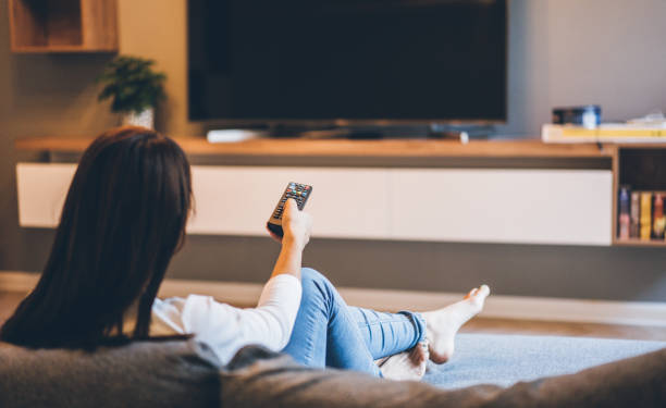 istock Woman watching TV 1043837226