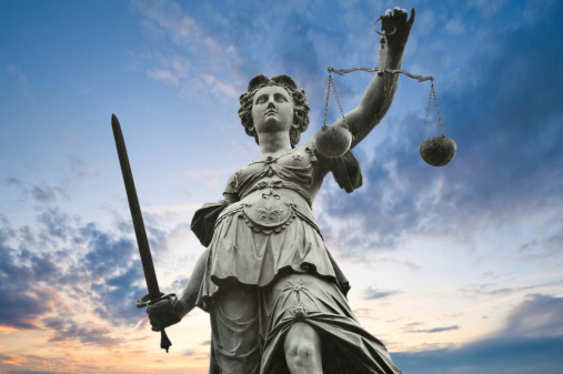 metal justice statue with sky in background in Frankfurt am Main, Germany