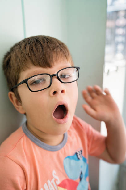 istock Little boy yawning 1043841258