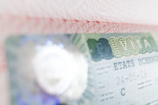 istock Visa stamp travel passport immigration macro emigration 1043842268