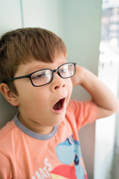 istock Little boy yawning 1043844132