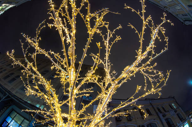istock Tree with bulbs in the form of illumination 1043844398