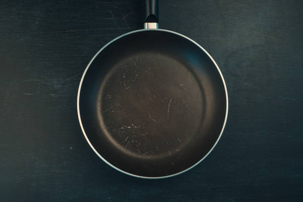 istock Used old empty frying pan skillet top view 1043845038