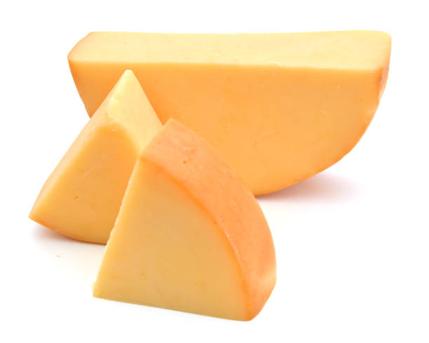 istock piece of cheese isolated on a white background 1043861580
