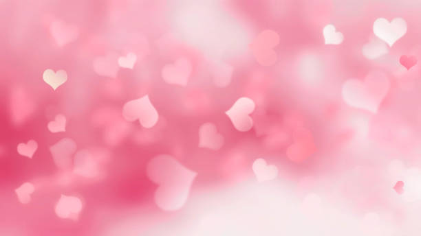 istock Pink background with hearts blurred 1043867950