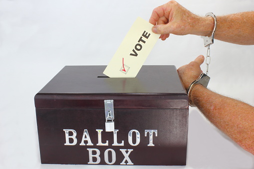 A convicted criminal voting in an political election.