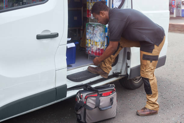 istock Fastening shoe lace at his van 1043899472