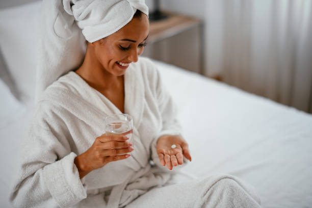 istock Beautiful woman having pills 1043902412