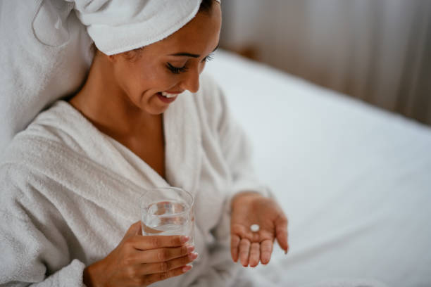 istock Beautiful woman having pills 1043902646