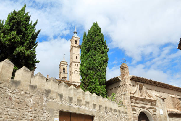 the bell tower of the holy mary collegiate ( colegiata de santa maria), seen from the calle goya street in borja, a small aragonese town in spain - religion christianity bell tower catholicism imagens e fotografias de stock