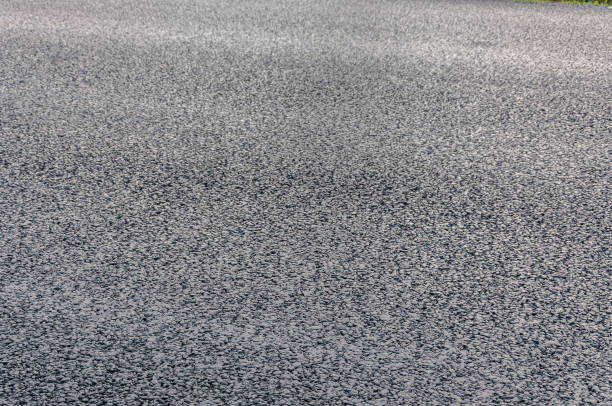 istock natural stone paving stone road from asphalt background summer 1043918170