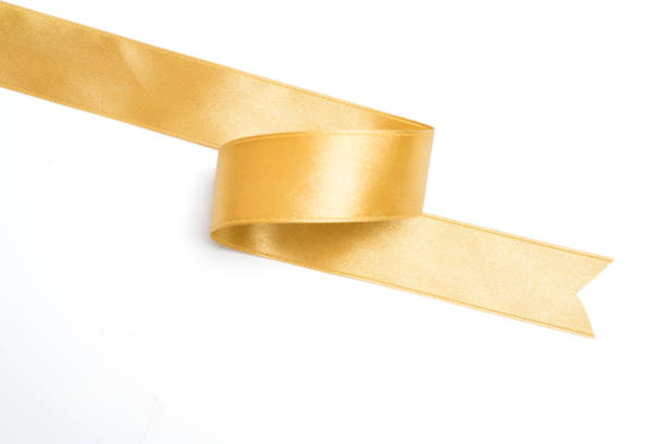 istock Gold ribbon in roll on white background 1043920762