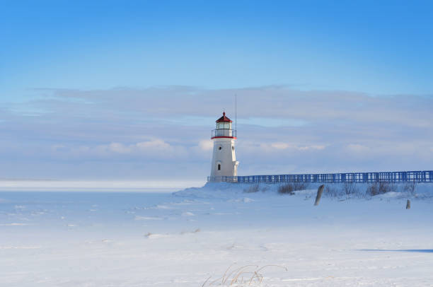 istock Lighthouse in a calm and desolate winter landscape. 1043921358