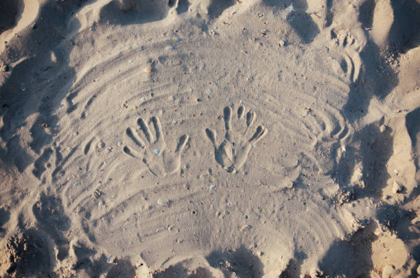 istock Seashore beach with sand, footprints in the sand, sand and seashells summer 1043923830