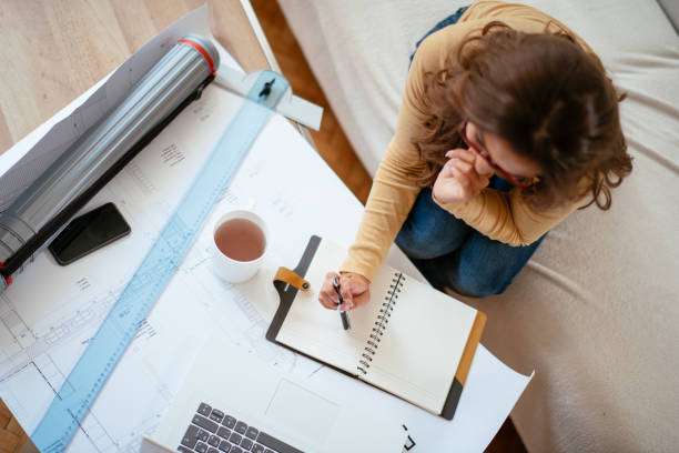 istock Young business woman working from home 1043947634