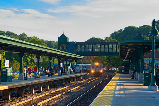 Peekskill, NY, USA - September 4, 2018: A morning commuter train heading to New York City pulls into the Peekskill station; The Metro North line serves communities along the Hudson up to Poughkeepsie.