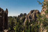 istock Awesome mountain landscape with sharp rocks and green trees at Blackhills National Forest , South Dakota , USA 1043972152