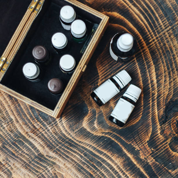 istock essential oils bottles on wooden background 1043994756