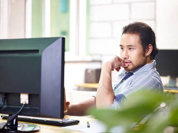istock asian businessman working in office 1043997378