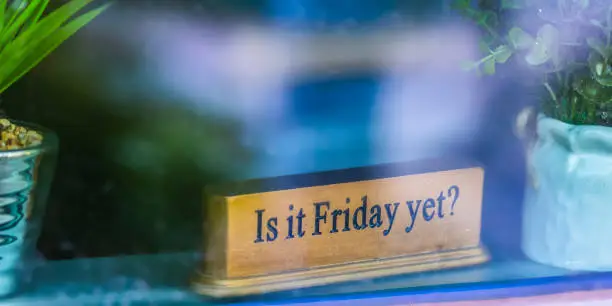 Photo of Is it Friday yet sign on windowsill with plants