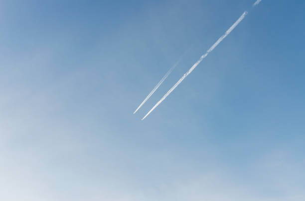 istock High flight. Contrails against a blue sky 1044002378