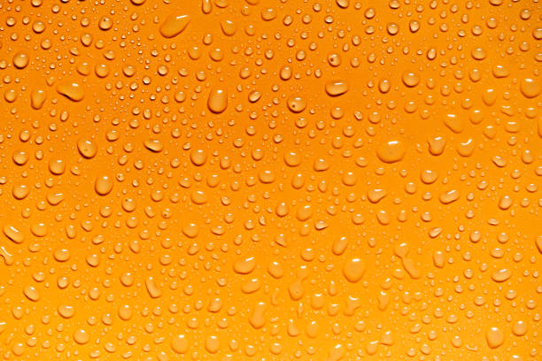 istock Water drops on yellow background, for design and advertising 1044005838