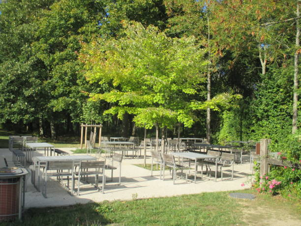 istock Coffee terrace in a public park Tables and benches 1044008670