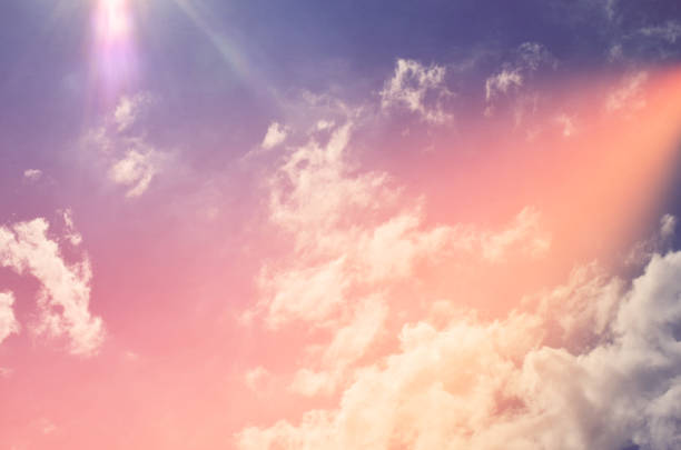 istock Nature background. Fluffy soft clouds in sky toned. 1044019084