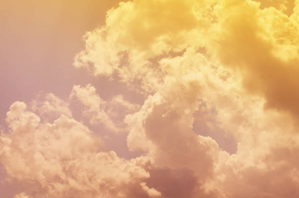 istock Nature background. Fluffy soft clouds in sky toned. 1044019132