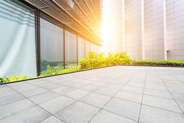 istock Square floor and modern city commercial building scenery 1044029274