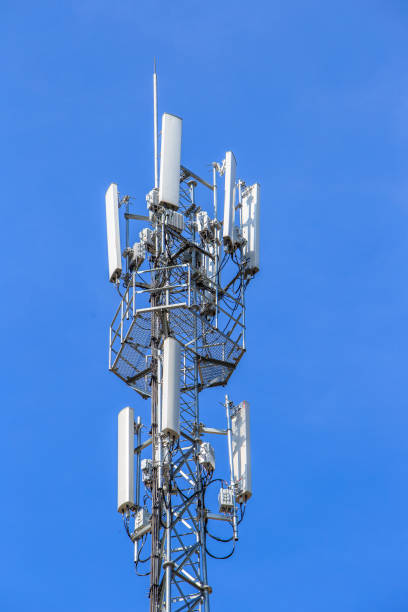 istock Mobile phone communication antenna tower with the blue sky and clouds, Telecommunication tower 1044031996