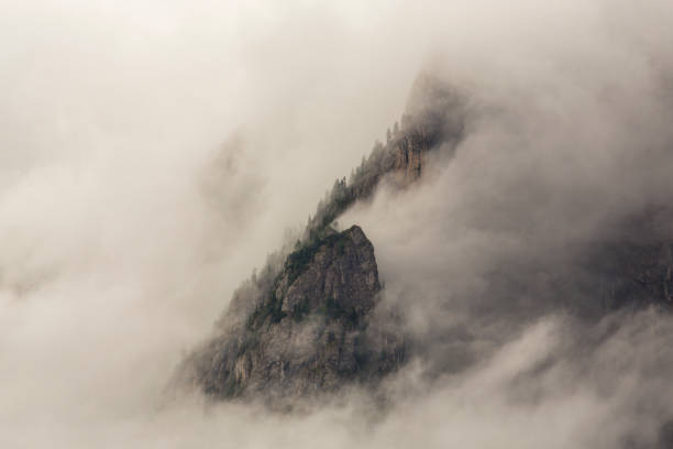 istock Dramatic sunset colors and rain clouds in the Dolomite Mountains, Italy 1044032182