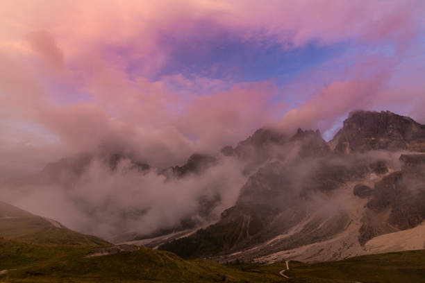 istock Dramatic sunset colors and rain clouds in the Dolomite Mountains, Italy 1044032258