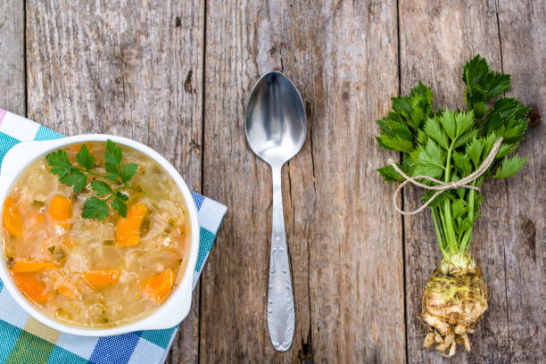 istock Vegetable soup in a bowl, top view on rustic table 1044035812