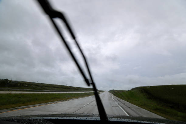 istock Driving down rain soaked highway with windshield wipers 1044035820