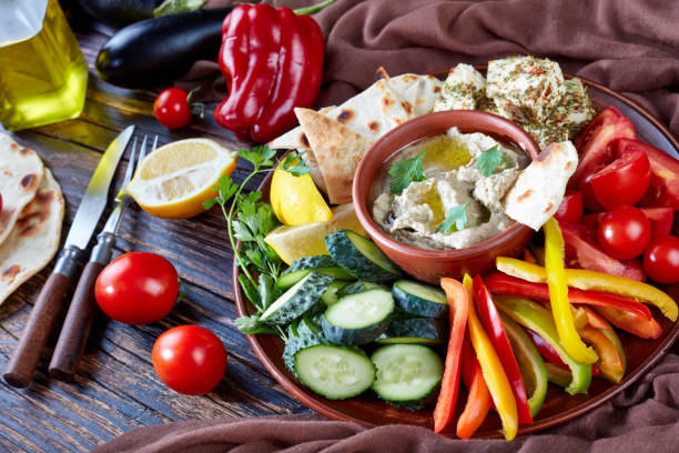 istock Fresh vegetables and baba ganoush dip, close up 1044040380
