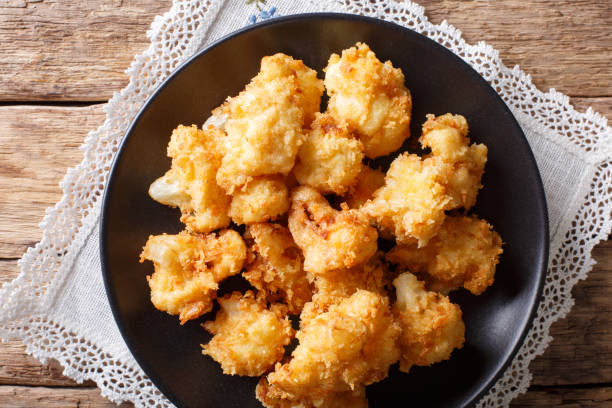 istock fried cauliflower in breading close-up. Horizontal top view 1044043126