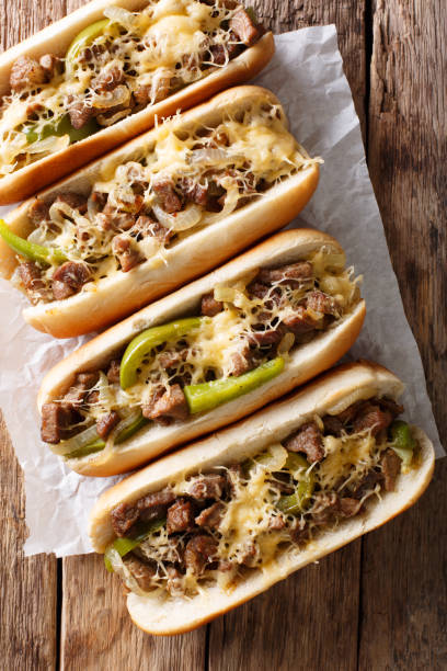 istock Philly cheese steak sandwich served on parchment paper close-up. Vertical top view 1044043660