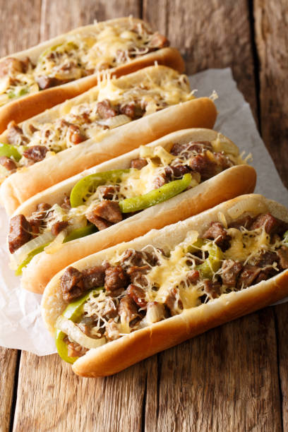 istock Street food: cheesesteak sandwiches close-up on the table. vertical 1044043690