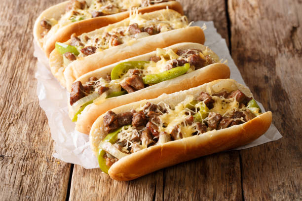 Philly cheese steak sandwich with onion and roasted pepper close-up. Horizontal